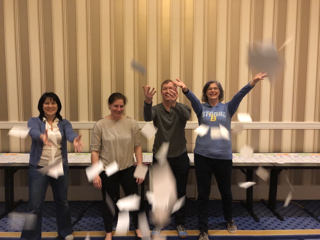 Christina and other members of the Agile2019 Program Team celebrate after creating the program for the conference.