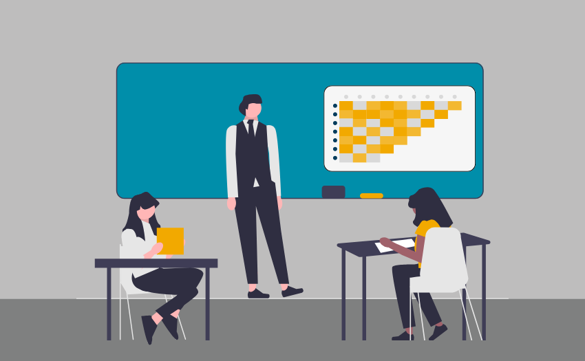 Learners and an instructor are in a classroom setting. The classroom board displays a graph that the instructor is teaching from.